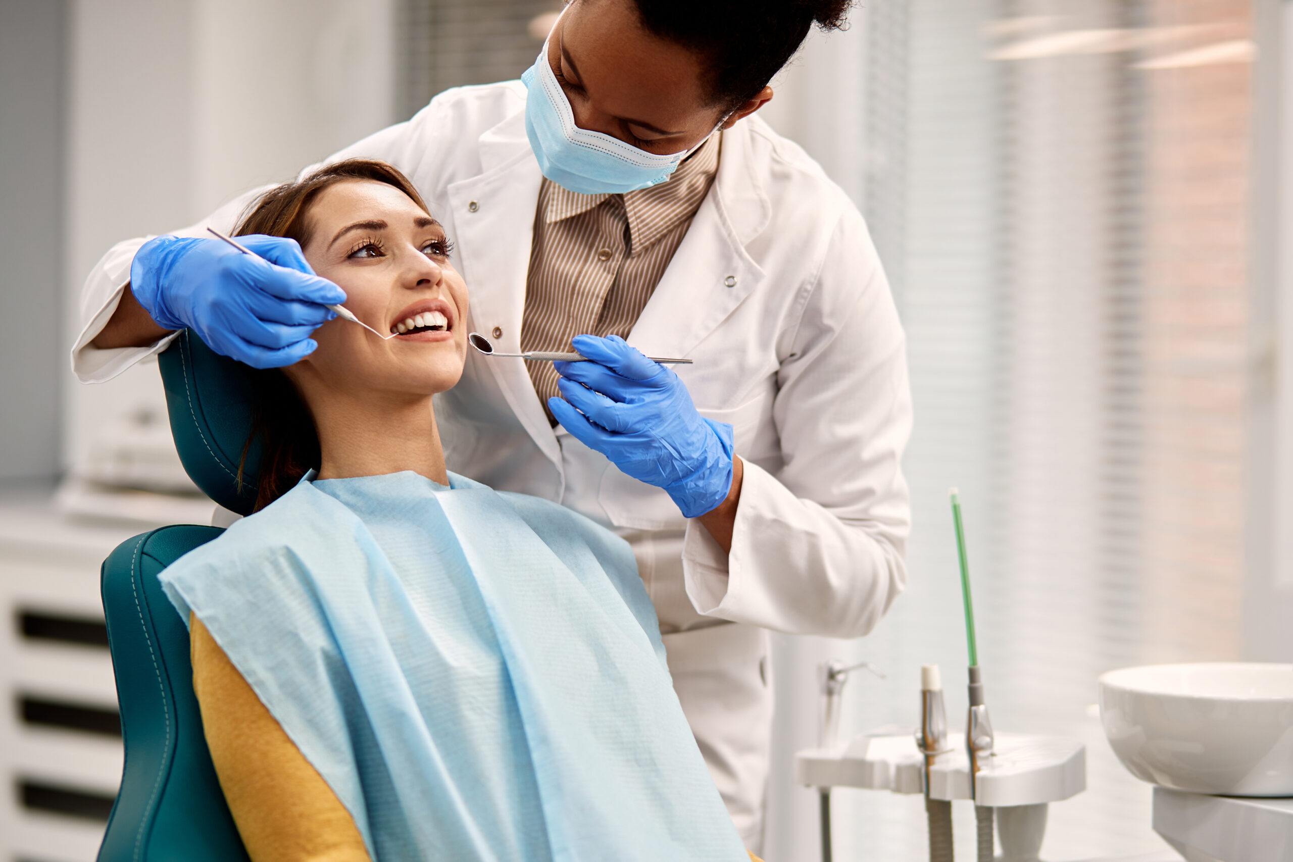 Lady in dental chair with Dentist having a dental exam